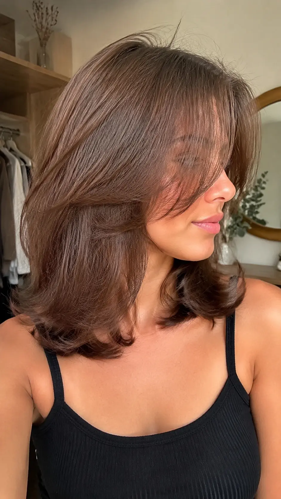 Shoulder length butterfly cut with face-framing layers