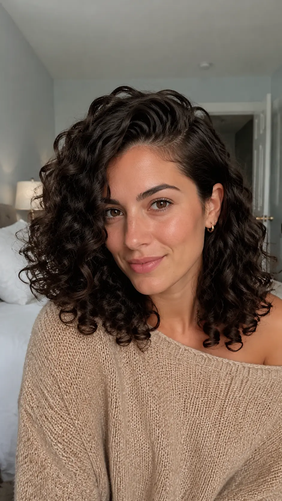Side-parted defined shoulder length curls