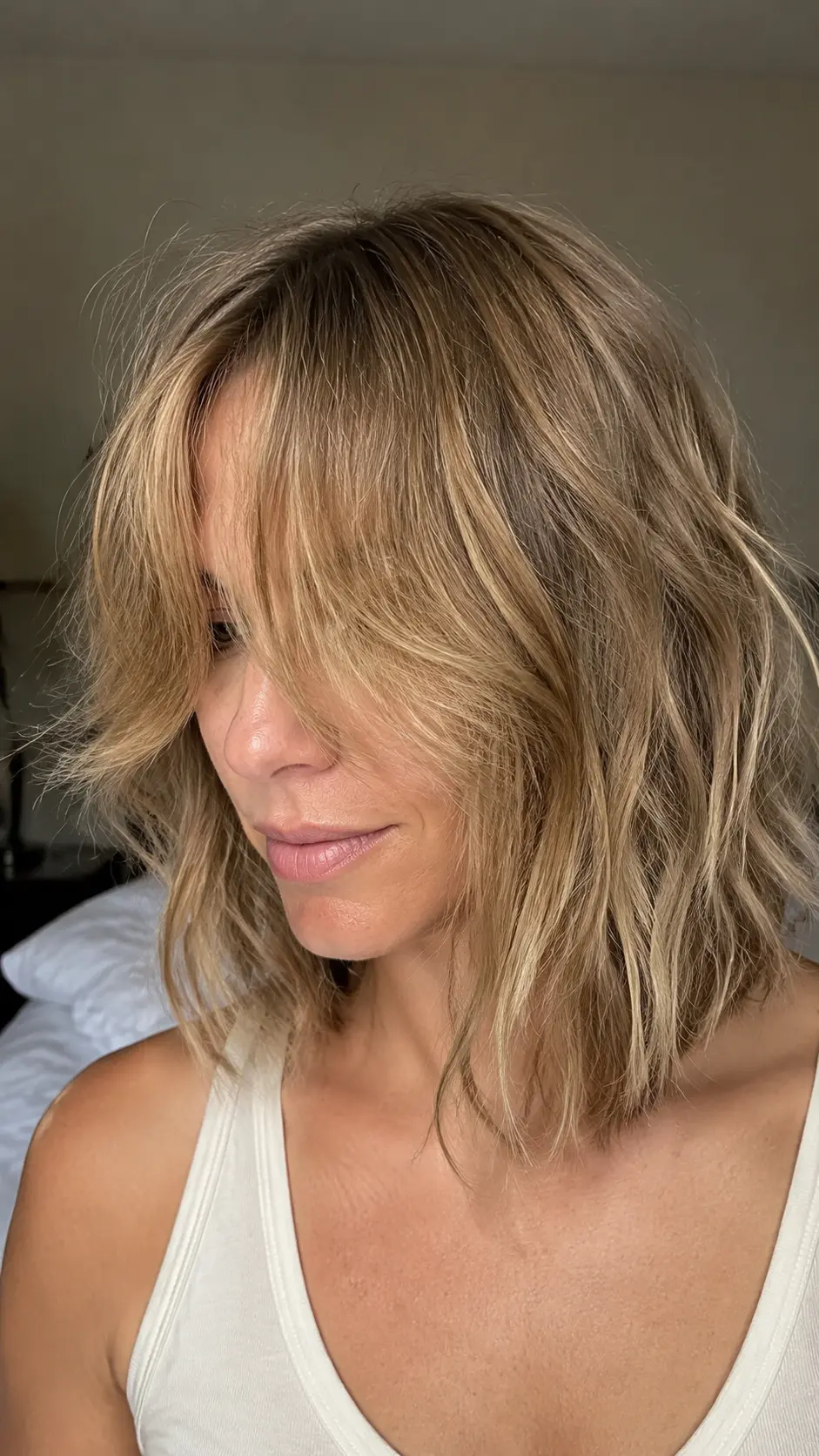 Textured shoulder length shag with curtain bangs