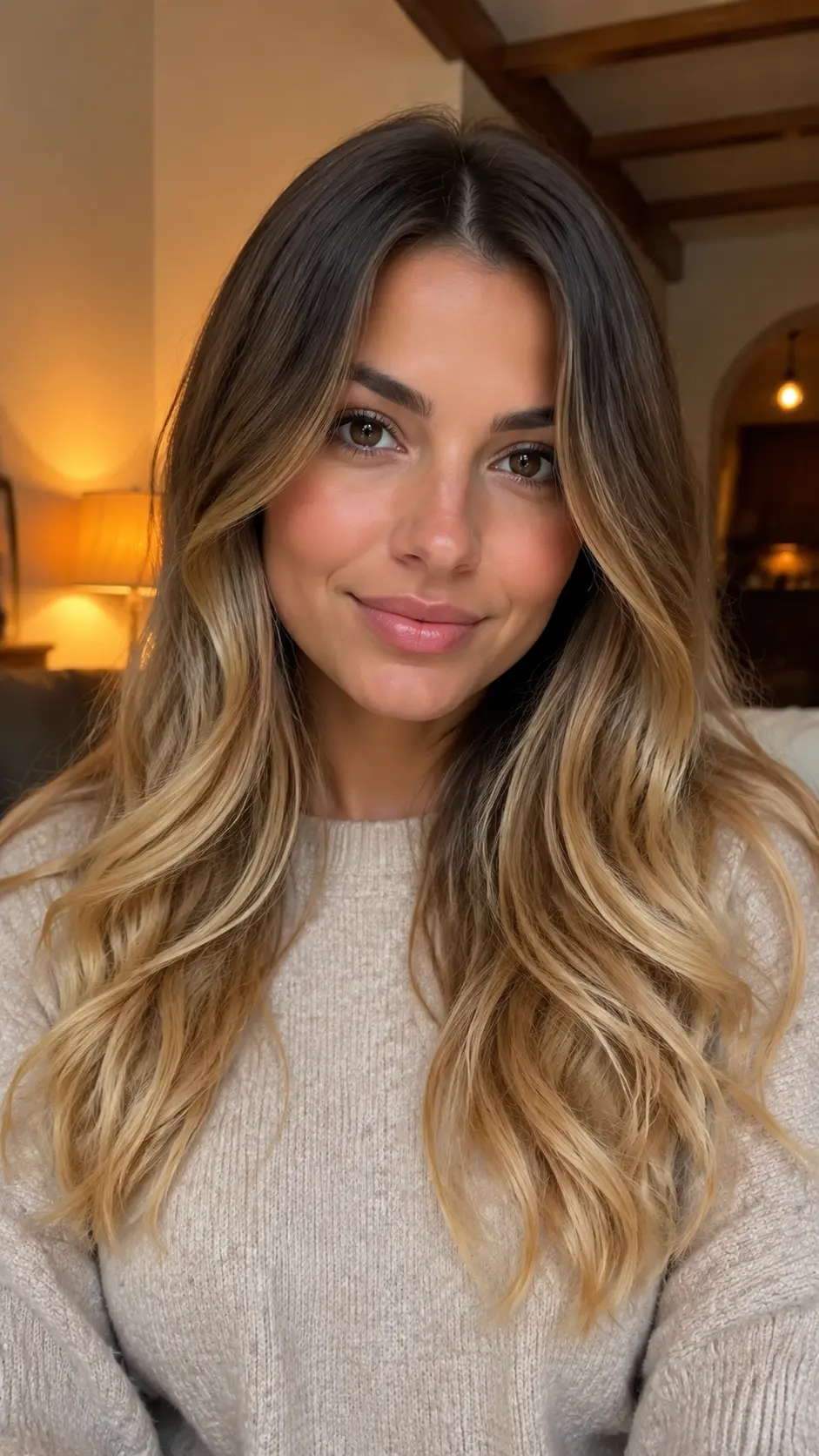 Dark brown roots with golden blonde ombre hair