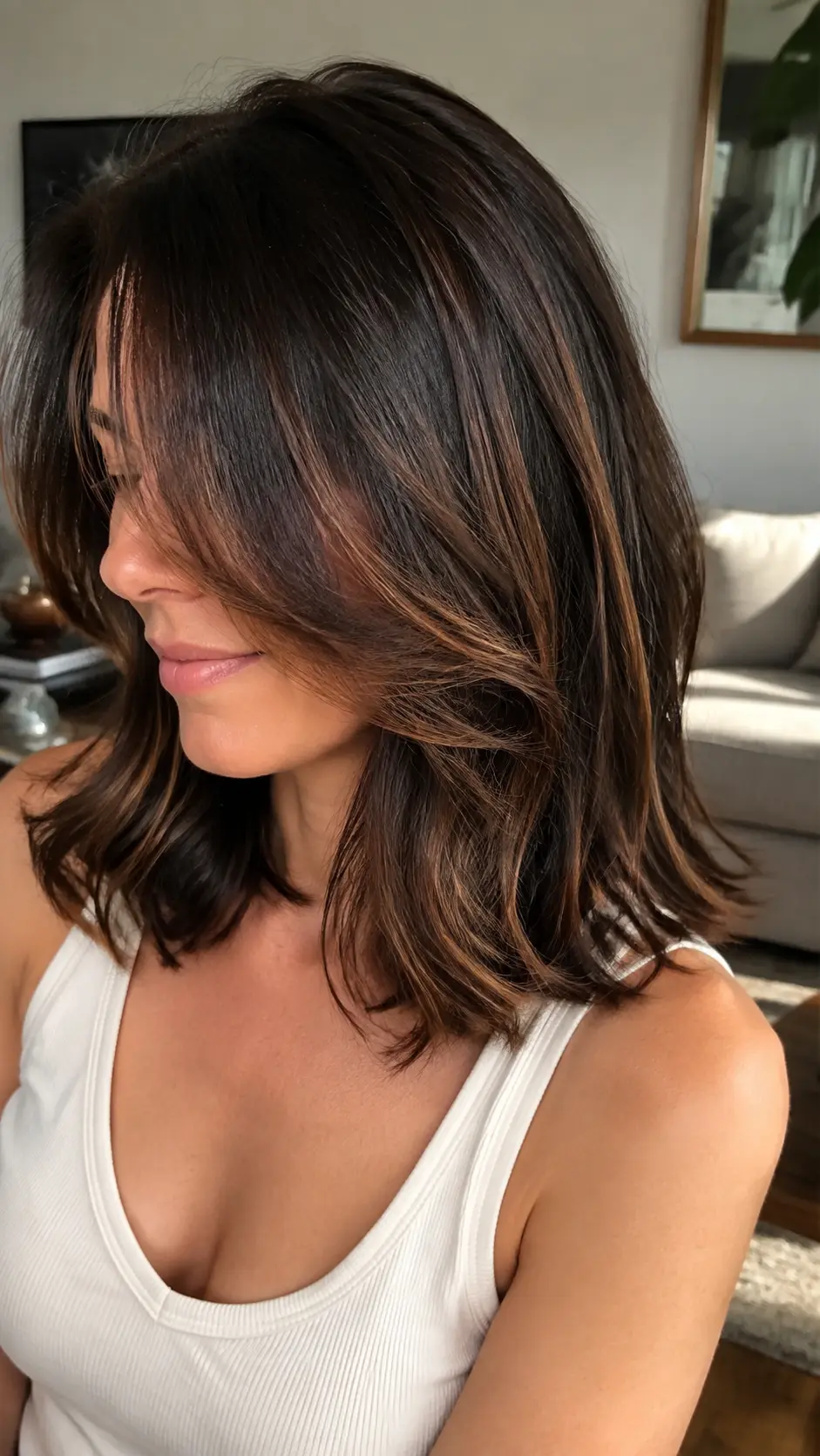 Shoulder length hair with face-framing layers and caramel highlights