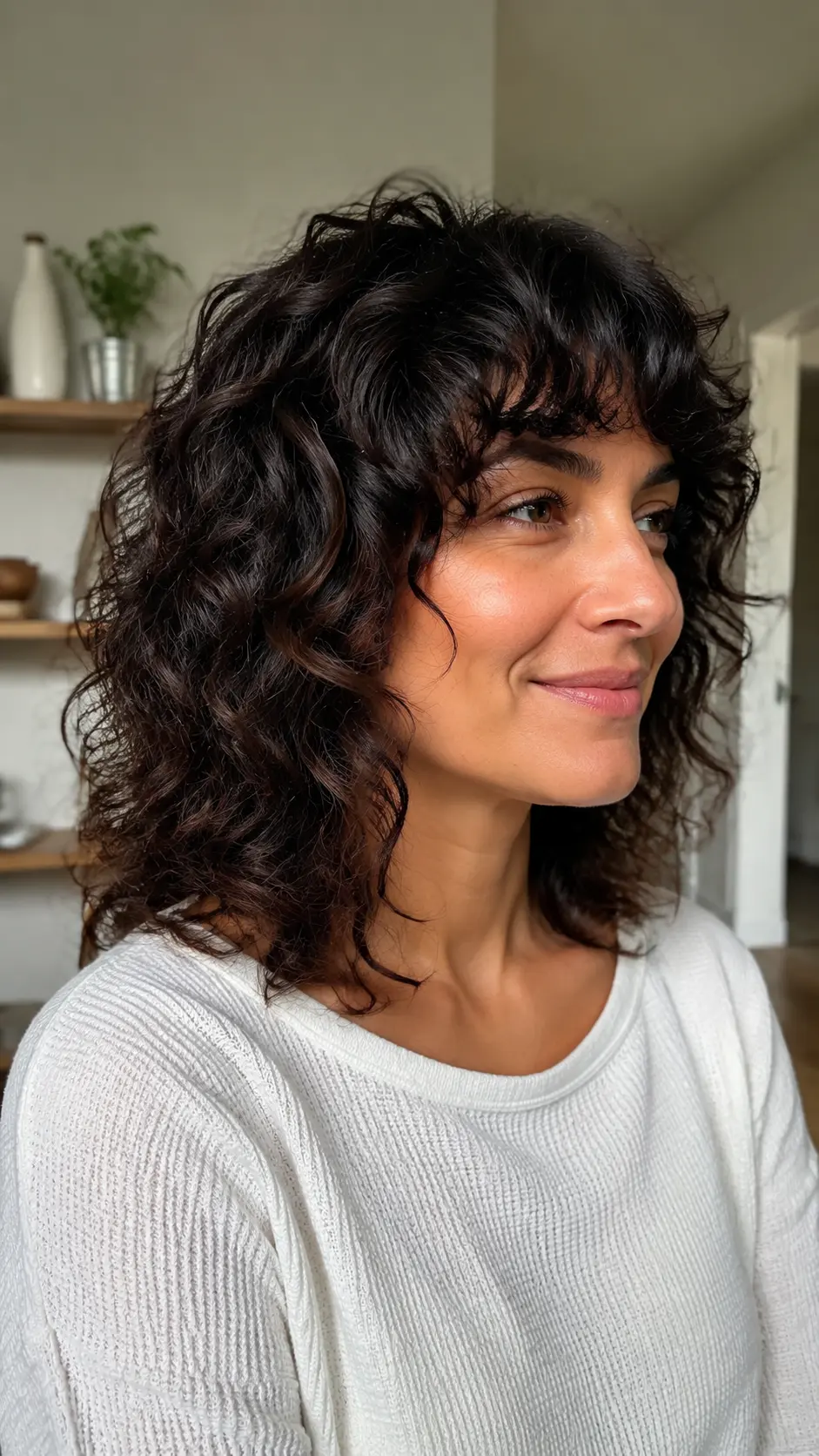 Shoulder length curly shag with textured layers