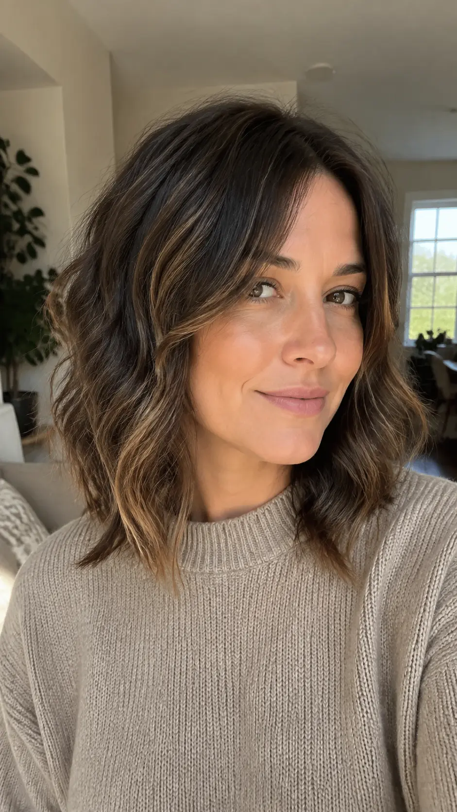 Brunette shag with sun-kissed blonde highlights