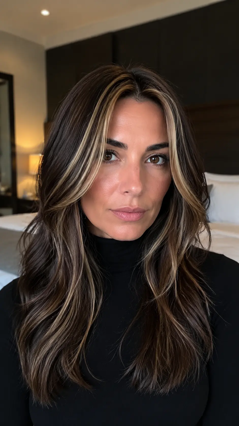 Dark brown hair with chunky 90s blonde highlights