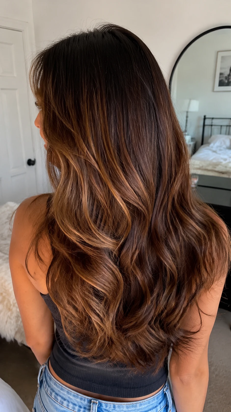 Luminous bronze brown hair color on layered waves