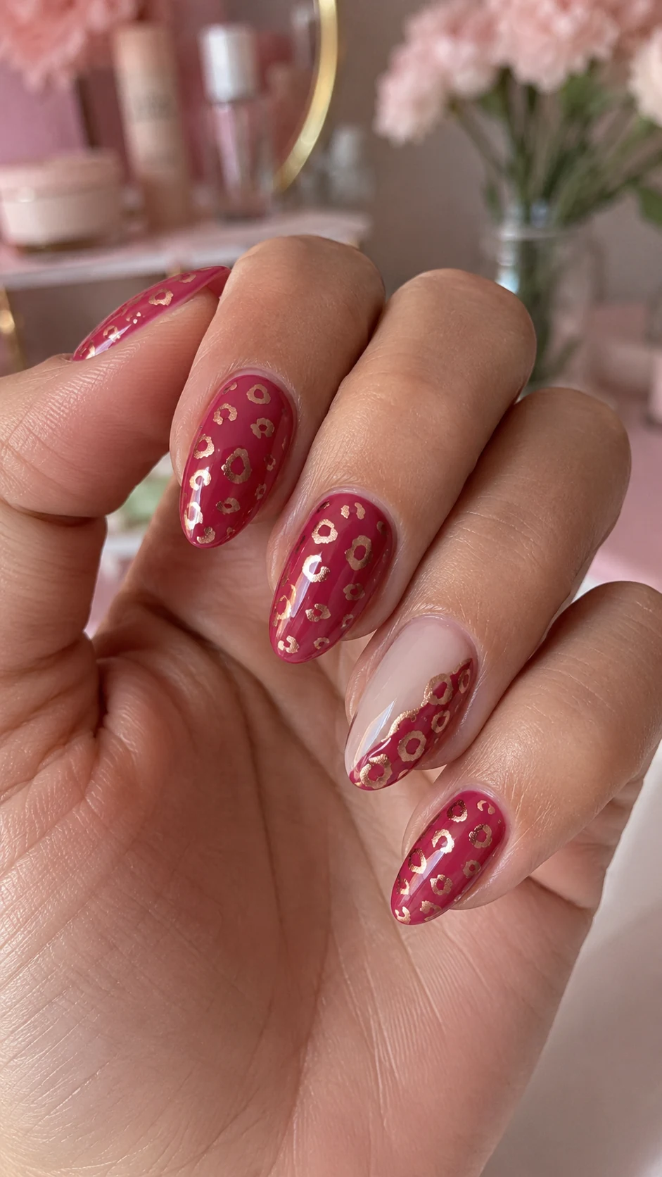 Raspberry pink nails with rose gold cheetah spots