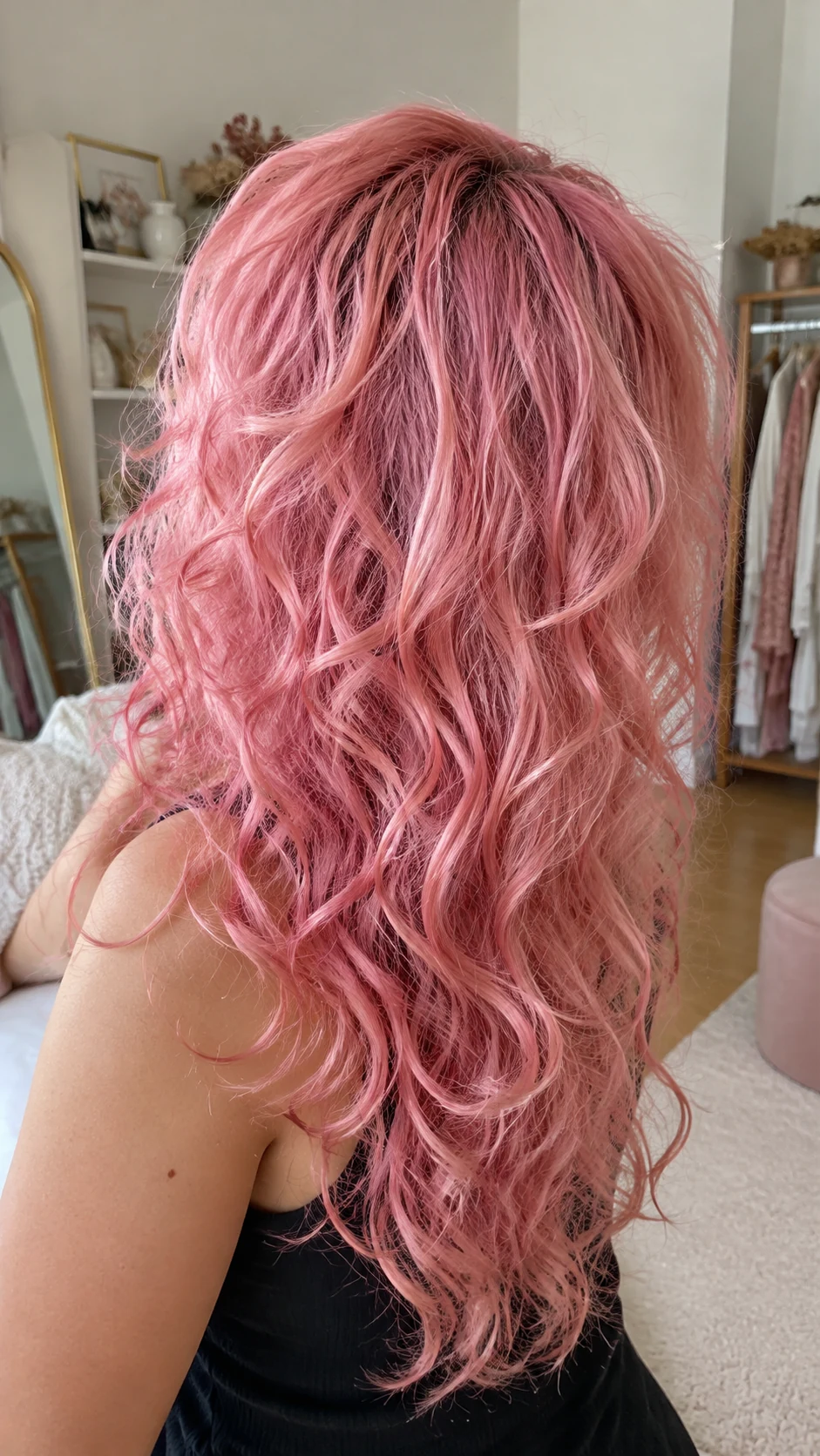 Voluminous cotton candy pink curls with pale highlights