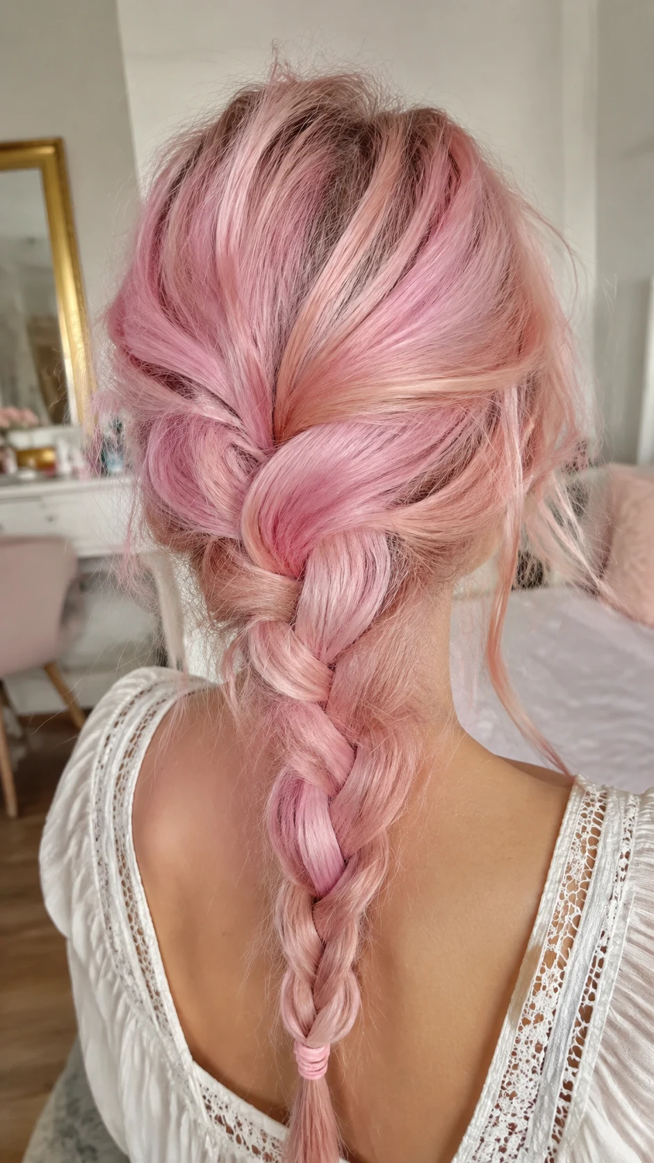 Loose romantic braid in cotton candy pink hair